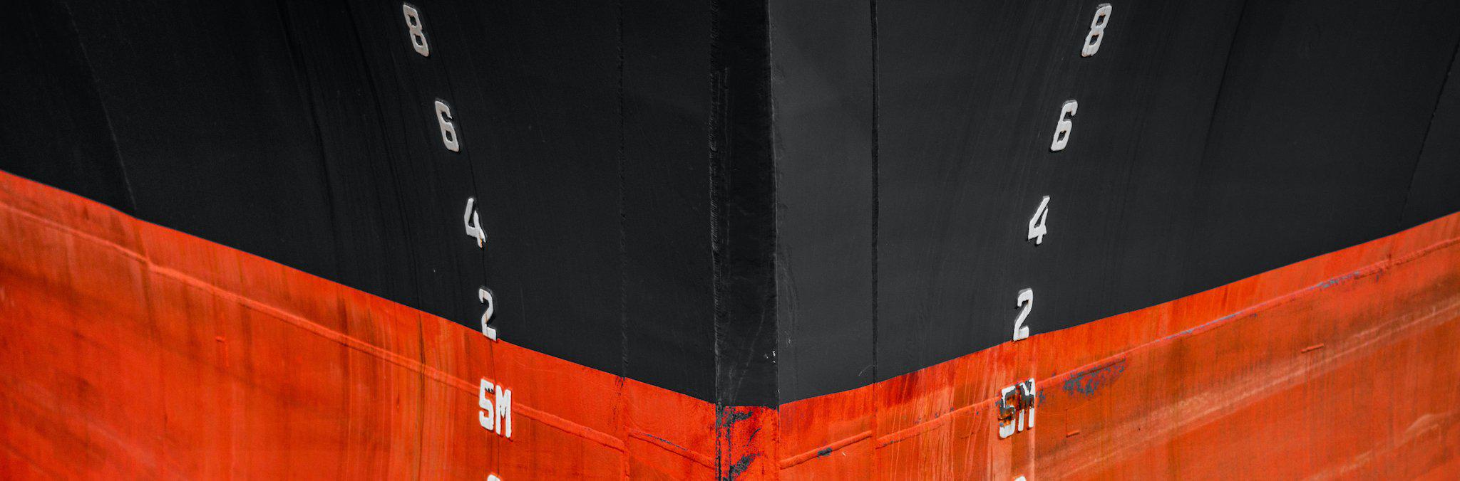 Drillship and crew boat underway in the open sea 